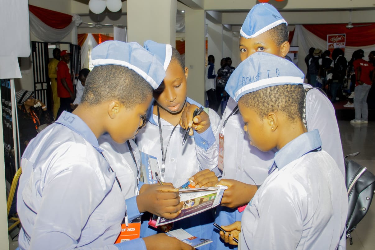 Students receiving individual advice from an education representative